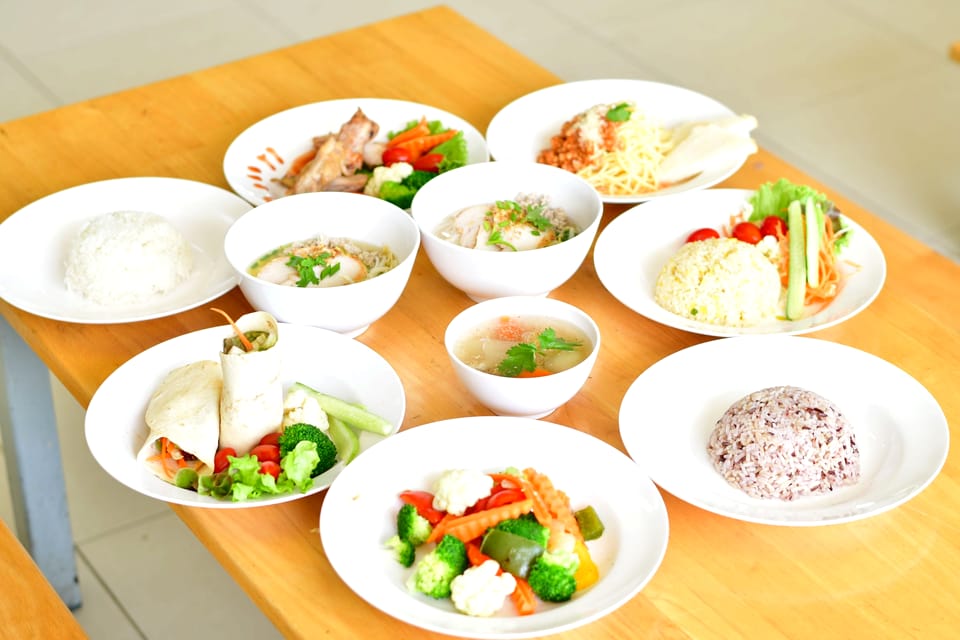 A spread of freshly prepared balanced meals with vegetables, rice, and soup
